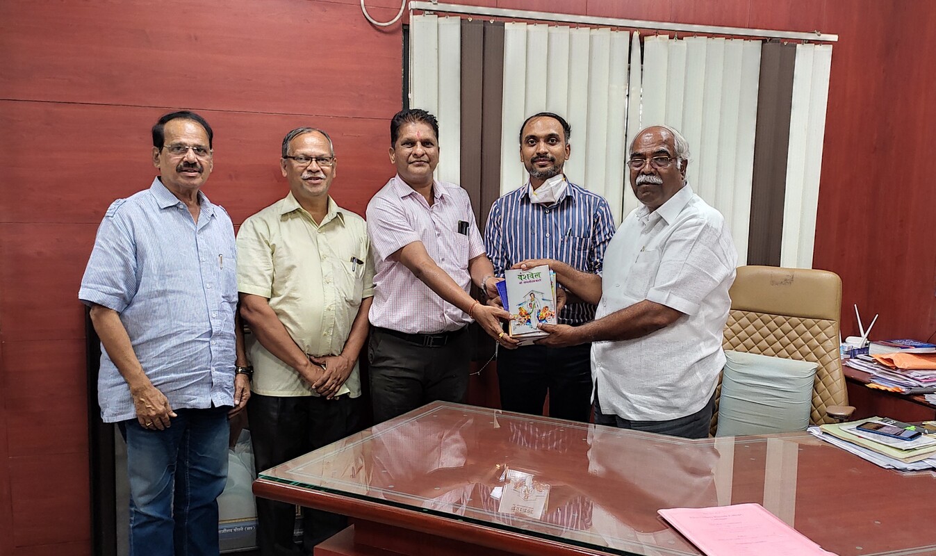 172326556406 Dr. Tanjirao Chorage - Book Donated to College.jpg